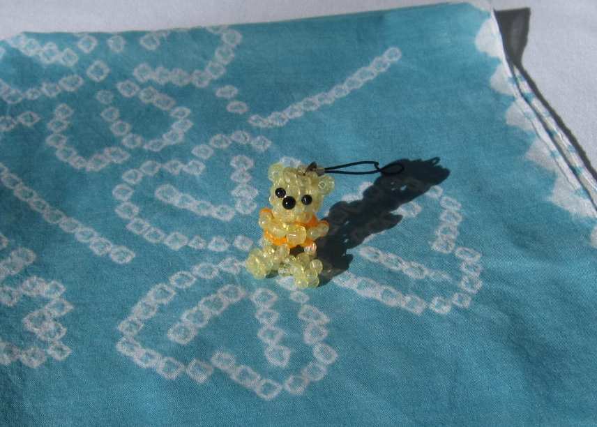 Beaded bear and handkerchief